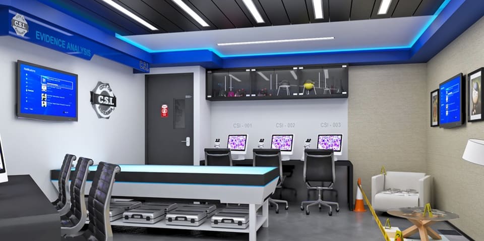 Themed retail showroom interior on Sheikh Zayed Road featuring a central polished stone-topped display island, wall-mounted screens, a glazed back-wall display unit, recessed blue LED cove lighting and linear ceiling fixtures, and large-format porcelain flooring in mid-grey.
